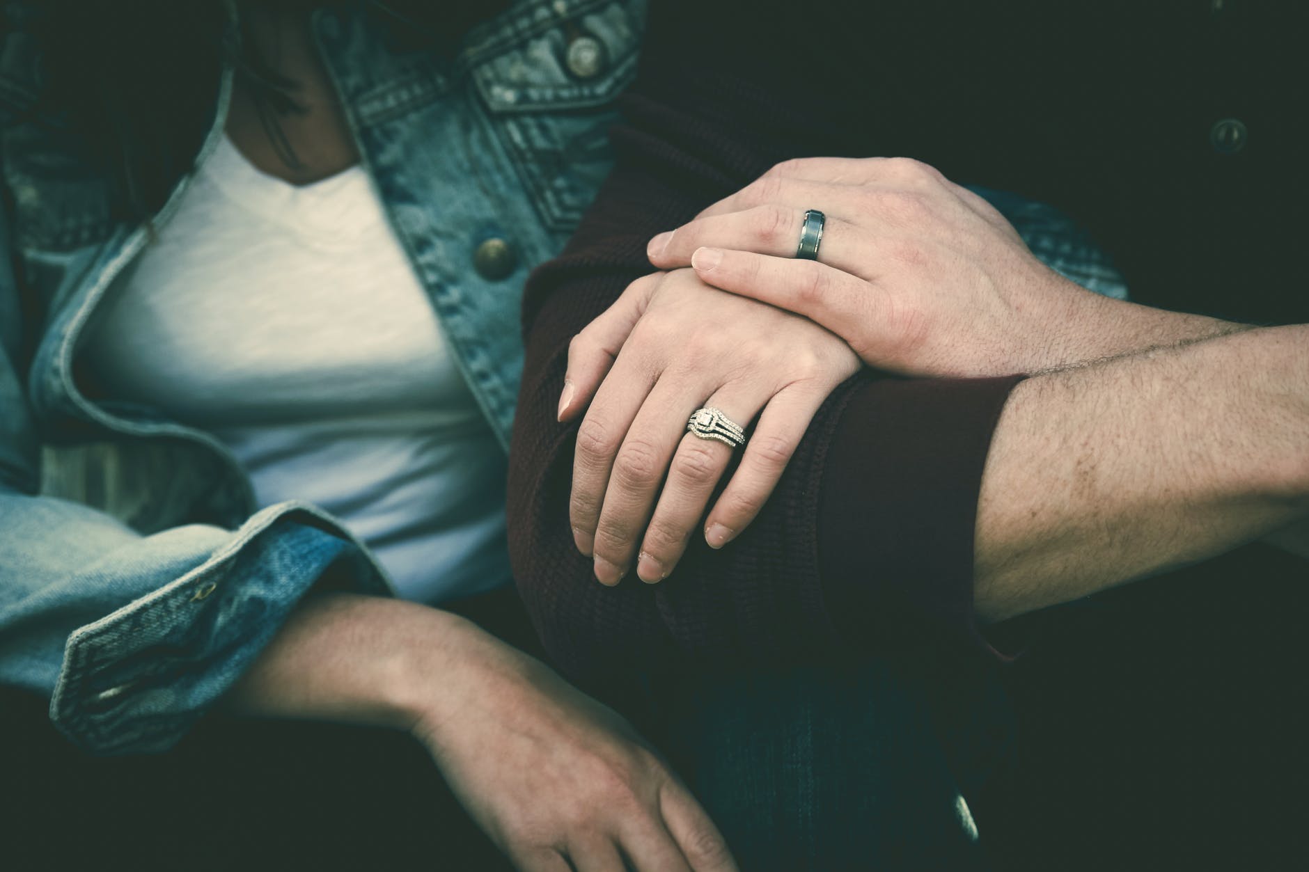 man and woman couple wearing their silver couple bond ring