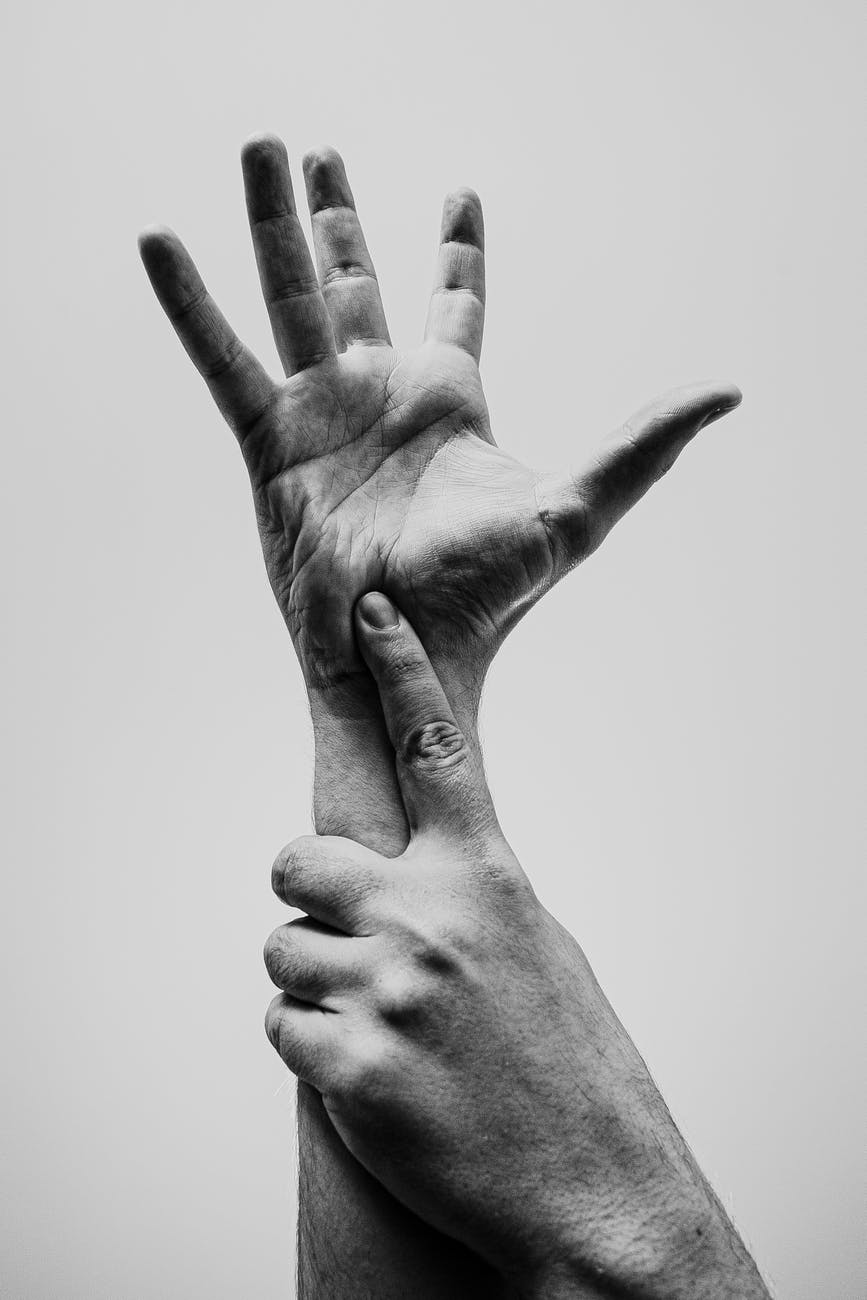 grayscale photo of persons hand